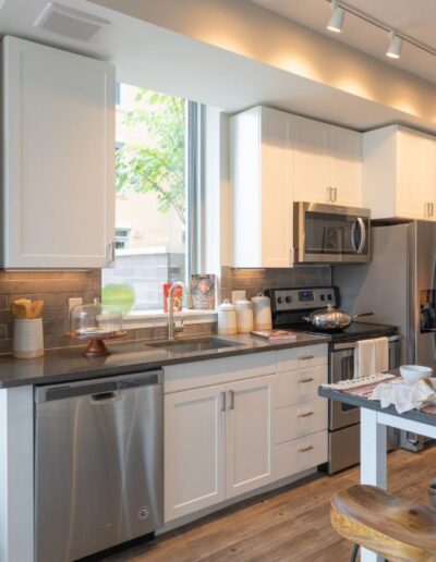 a beautiful kitchen view with table plates and portrait image placed